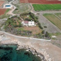 INVESTMENT OPPORTUNITY 5000m2 beachfront land for sale Ormidhia-Dhekelia with a small bungalow.